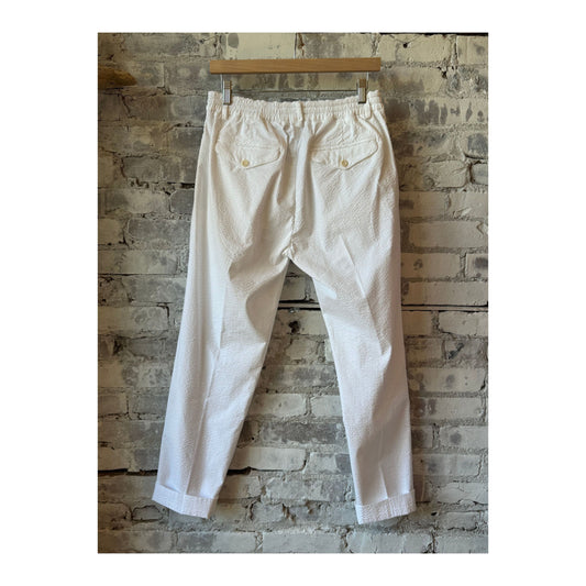 Men's white seersucker pants from 04651, featuring lightweight, striped fabric and a tailored fit, perfect for warm weather.