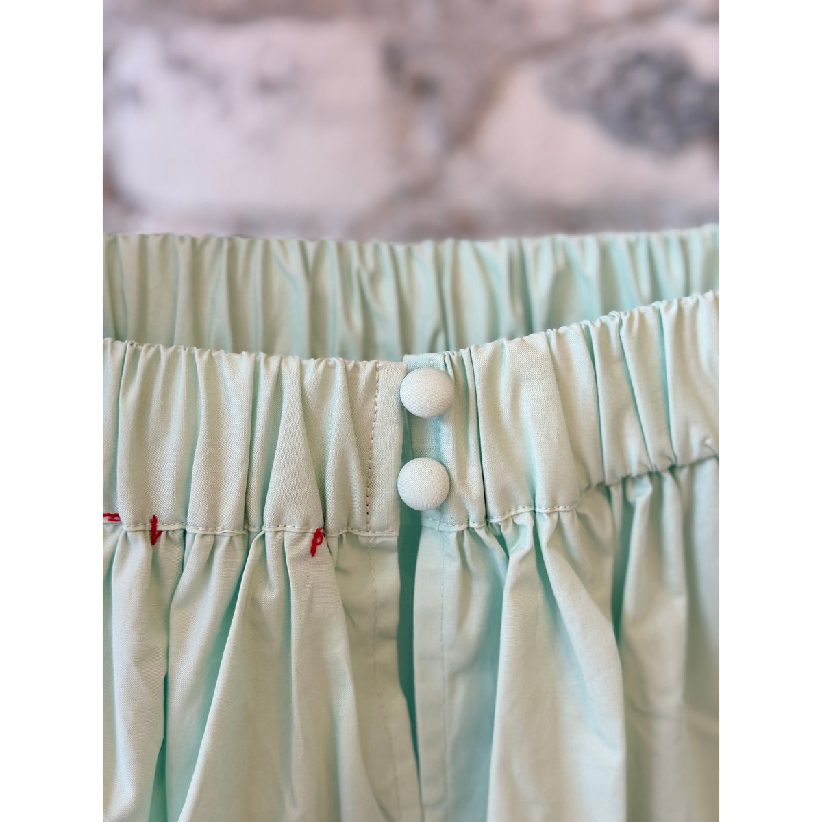 Women's mint scallop dress by Brazeau Tricot, featuring a stylish scalloped hem and elegant fit, shown on a model.
