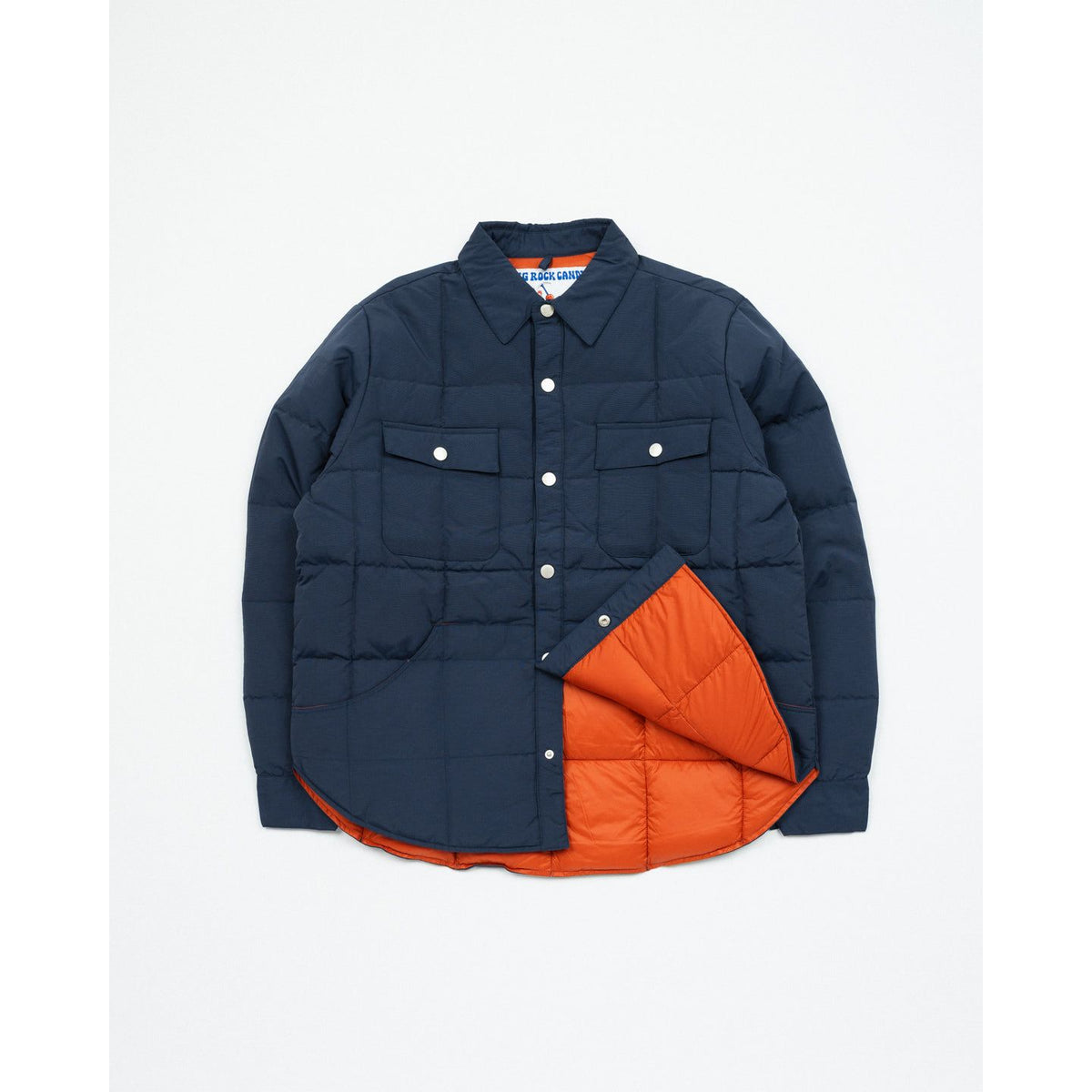 Men's Bridalveil Jacket in blackberry color by Big Rock Candy Mountaineering, shown in outdoor mountain setting.
