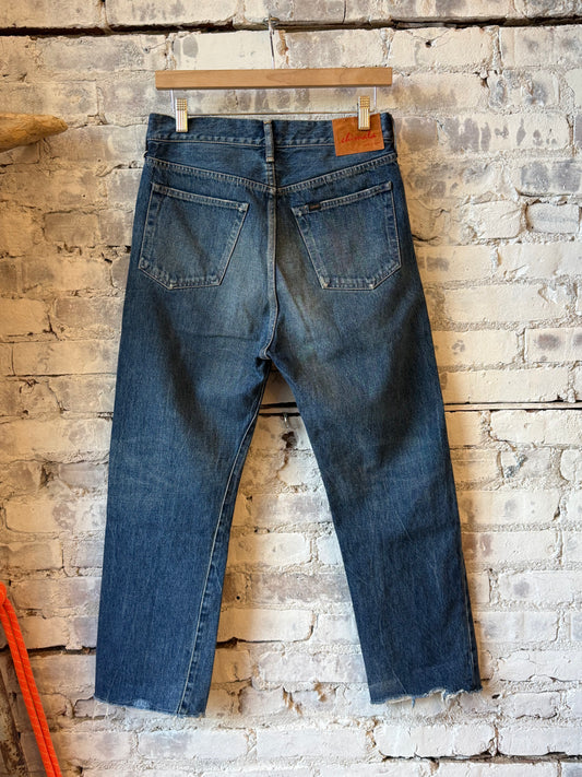 Women's 13.5oz dark vintage selvedge denim ankle jeans by Chimala, showcasing a fitted silhouette and raw hem detail.