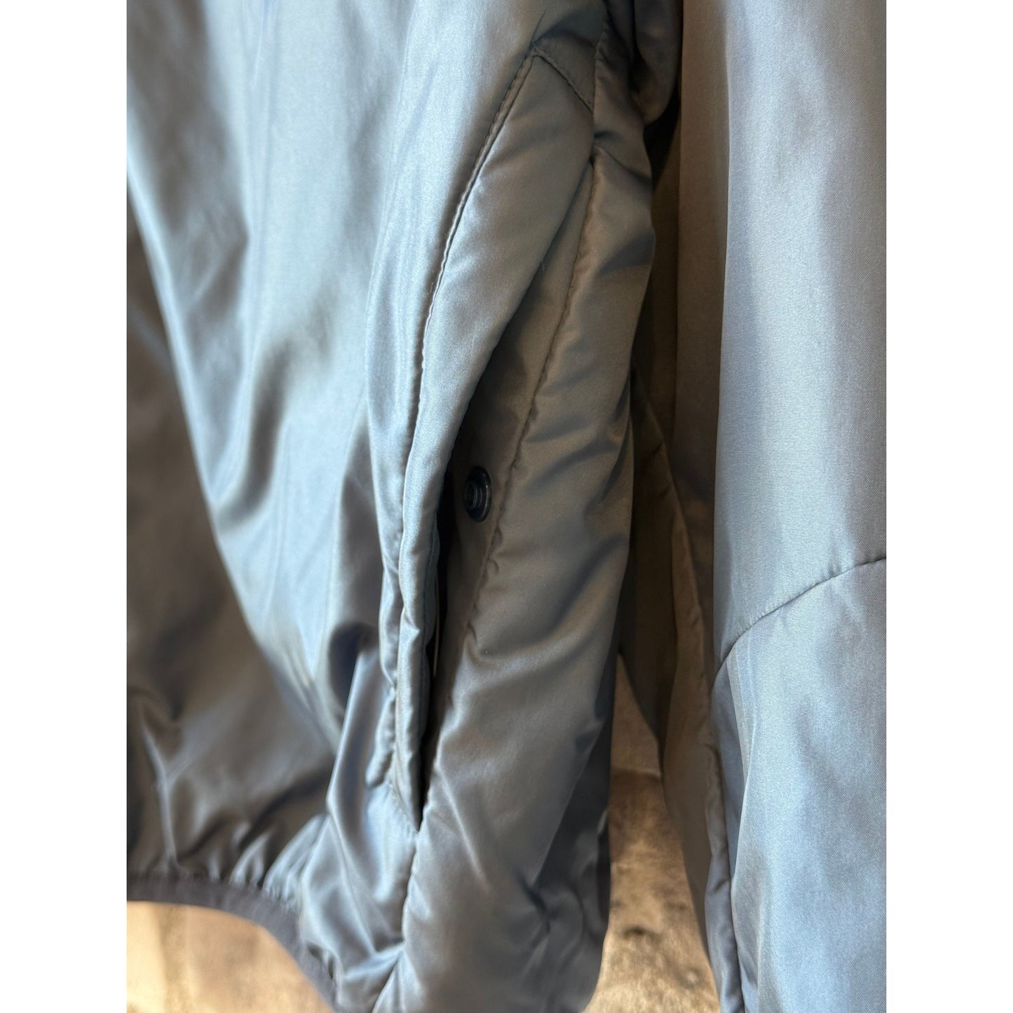 Women's two-tone navy nylon reversible jacket by Aspesi, showing the front view with a sleek, modern design and two-tone color detail.