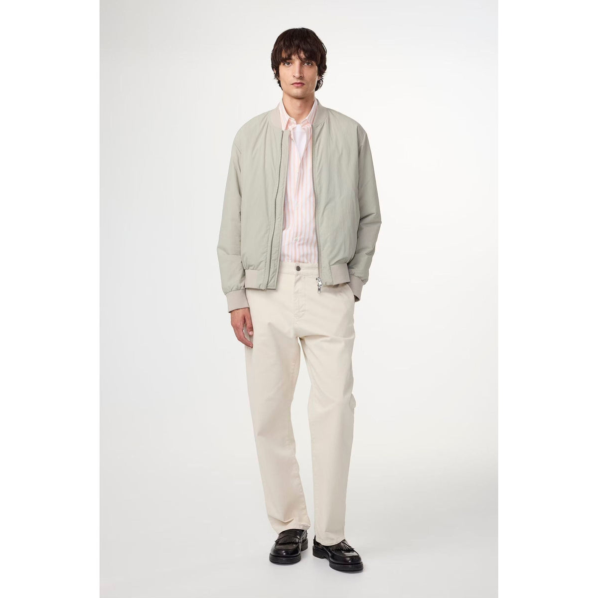Men's NN07 Aden Regular Fit Chino in ivory, front view showing classic waist and pocket details.