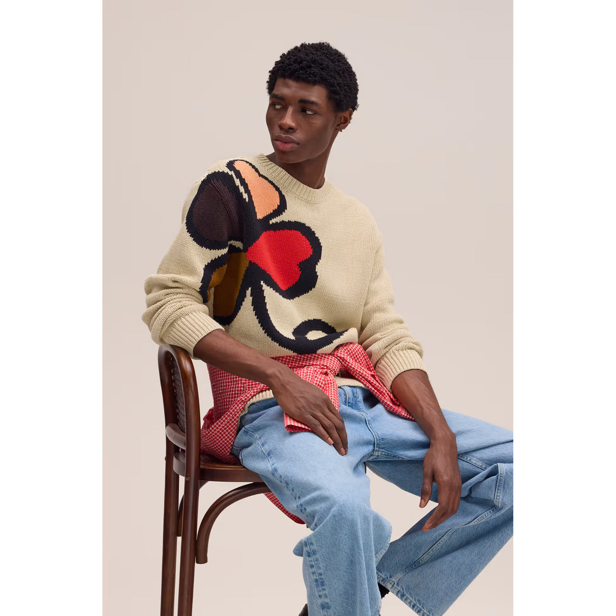 Men's NN07 Todd Sweater in ecru, featuring a soft knit fabric and classic crewneck design, shown in a close-up view.