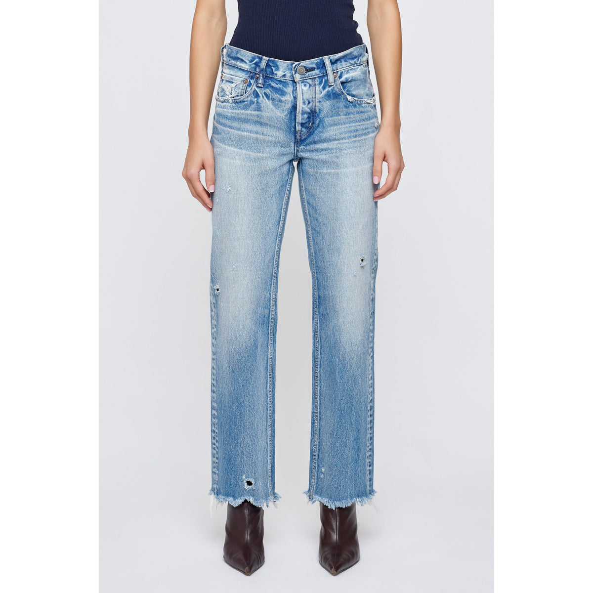 Light blue Moussy Mattapan straight low women's jeans displayed on a model, showcasing a slim fit and classic denim style.
