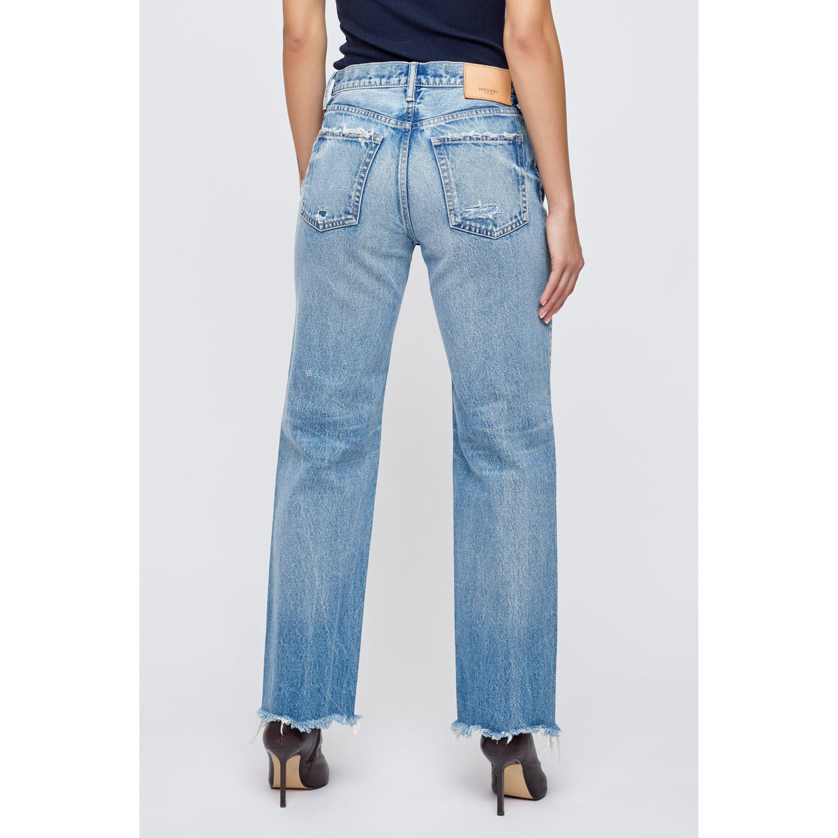 Light blue Moussy Mattapan Straight Low women's jeans displayed on a model showing the full length and fit.