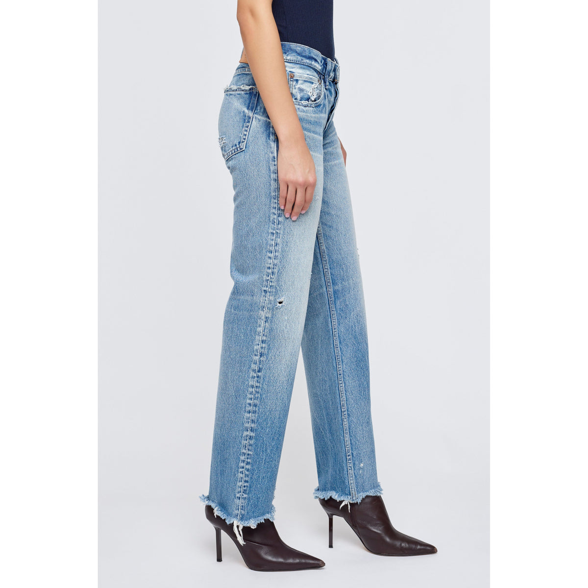 Light blue Moussy Mattapan Straight Low women's jeans displayed on a model, showcasing a relaxed fit and classic denim style.