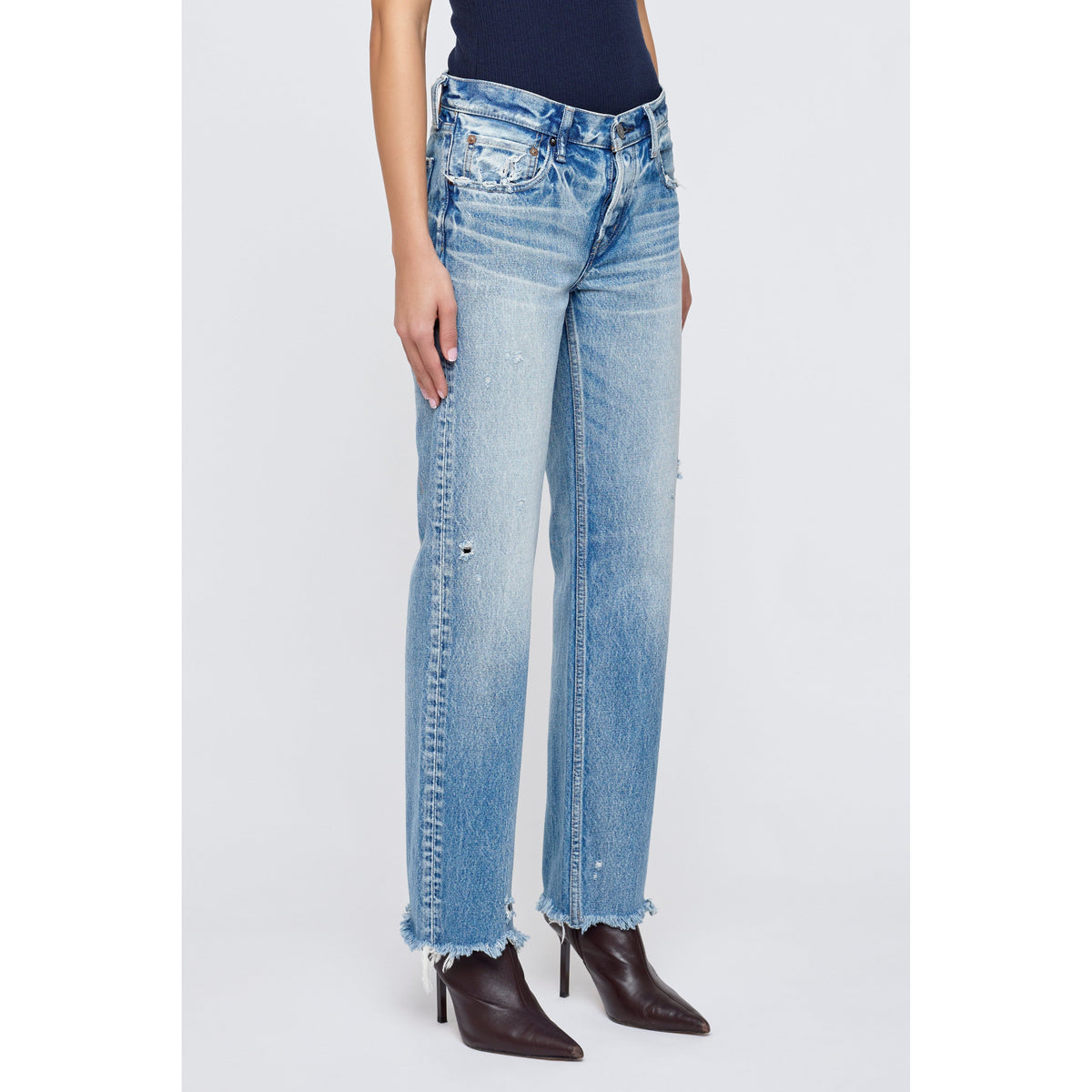 Light blue Moussy Mattapan Straight Low women's jeans displayed on a model, showcasing a slim fit and classic denim style.