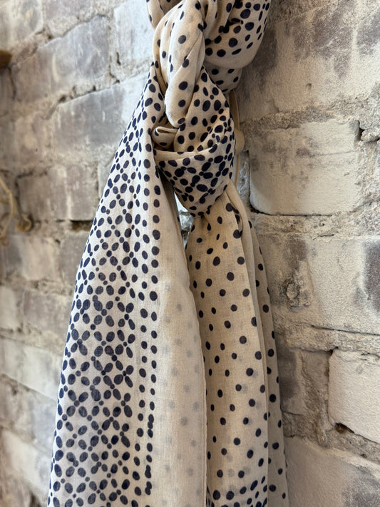 Light beige woven women's scarf with dot pattern from Hartford Women's, featuring a soft, stylish design for versatile wear.