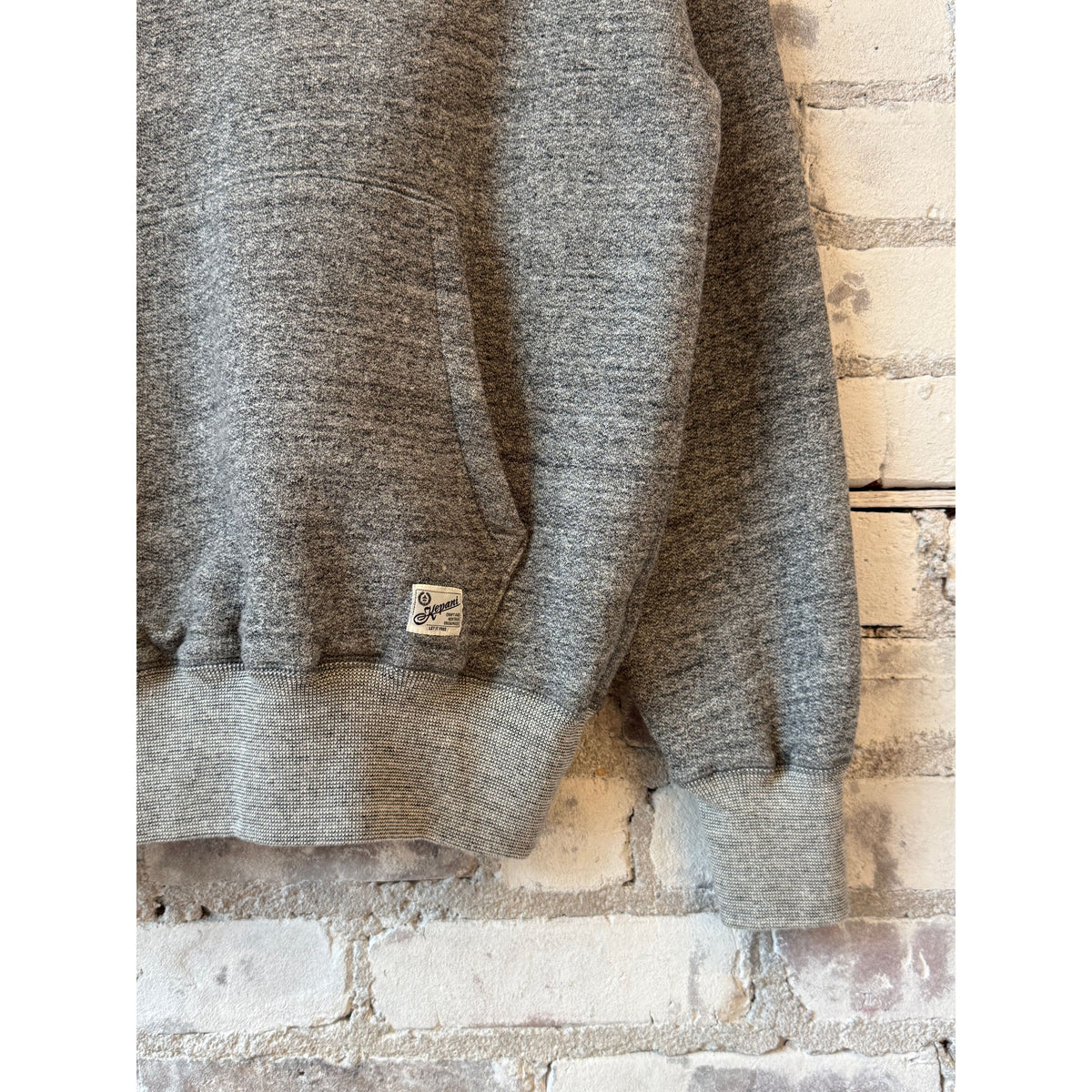 Men's gray Kepani Manchester 2 pullover hoodie with front pocket and drawstring hood, casual and comfortable for everyday wear.