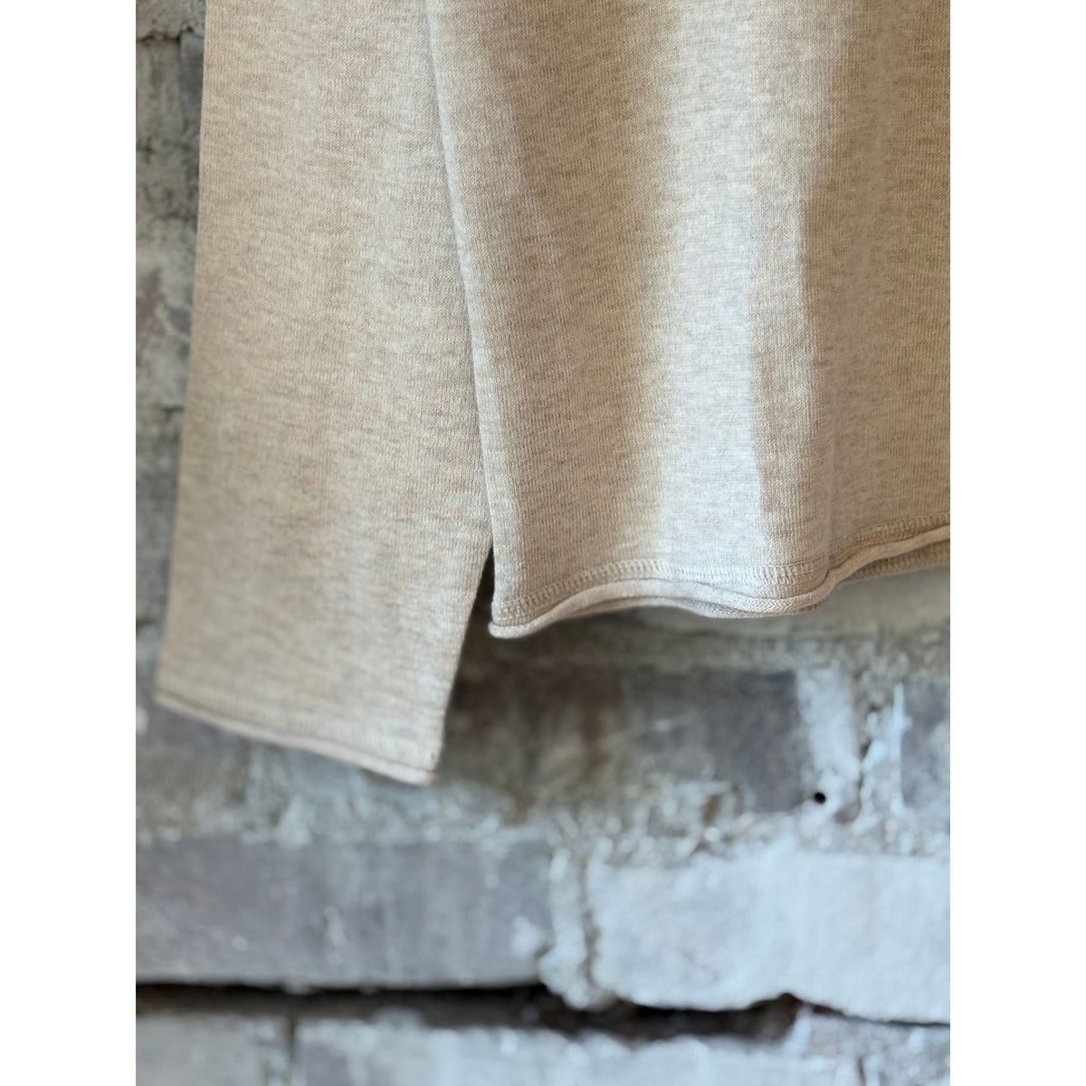 Men's Hartford Crew Knitted Pullover in natural color, close-up of soft, textured knit fabric and classic crew neck design.