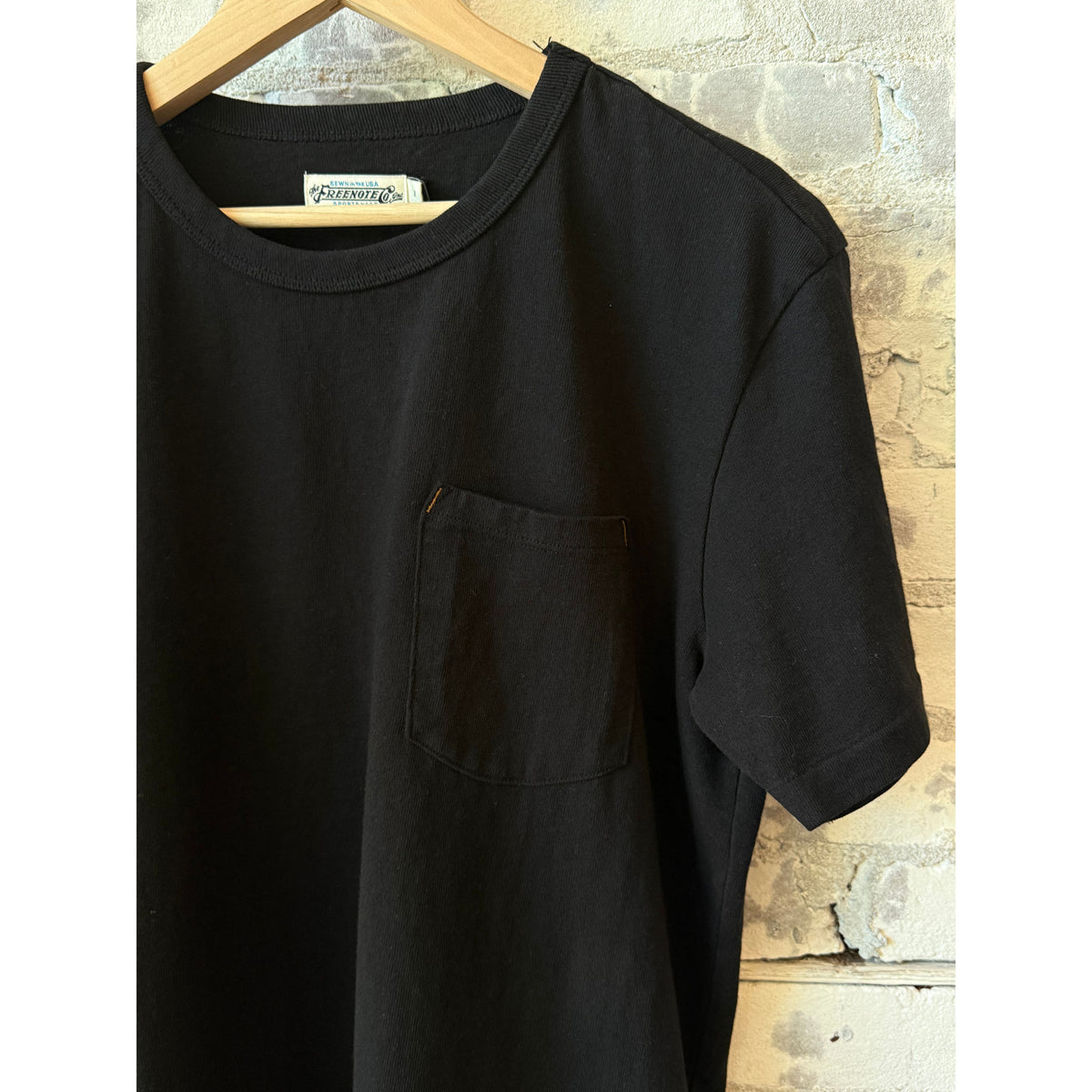 Men's black 13-ounce pocket tee by Freenote Cloth, featuring a classic fit and front pocket detail.