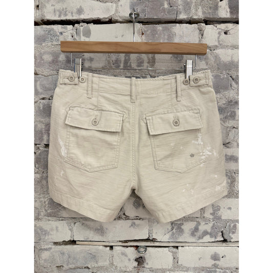 Women's Surplus Short Shorts by G1 with paint splatter canvas design, featuring a casual, distressed style and frayed hems.