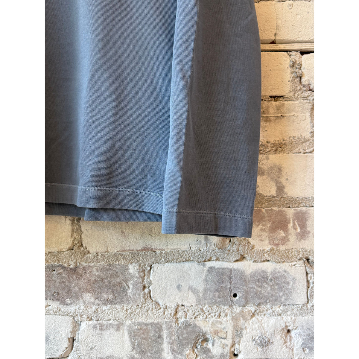 Men's light fleece rugby knitted polo in denim, Hartford Men's brand, featuring a classic collar and textured knit fabric.