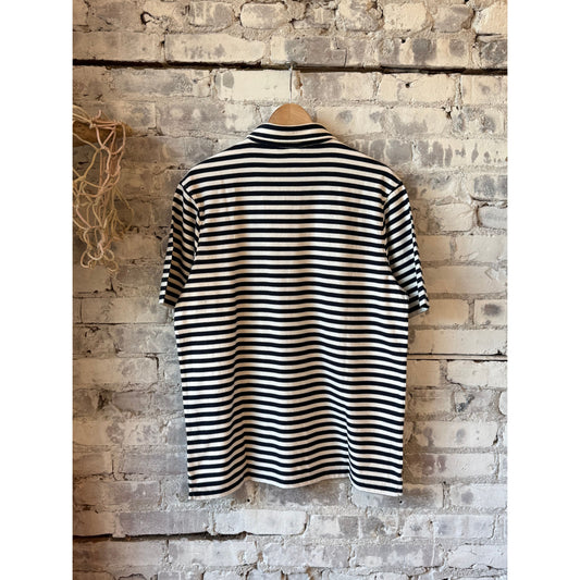 Men's navy and eggshell striped knitted polo shirt by Hartford Men's, featuring a classic polo collar and short sleeves.