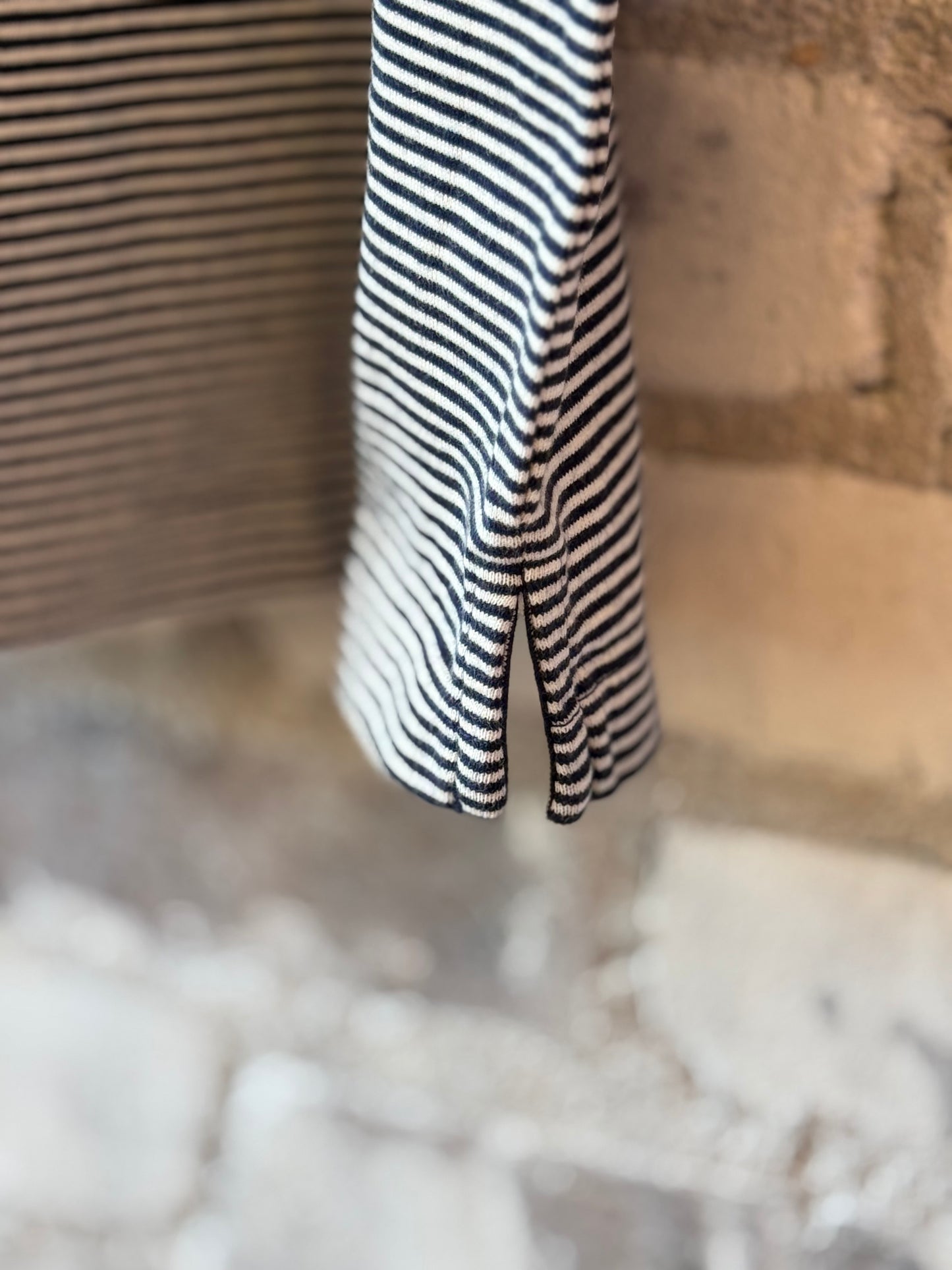 Men's navy and white striped knitted polo shirt by Hartford Men's, featuring a classic polo design with a collar and short sleeves.