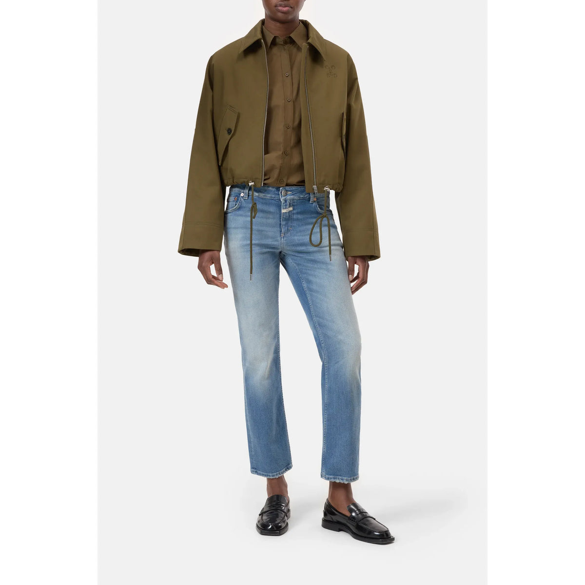 Closed Women's Junna Straight Jean in mid blue denim, shown hanging with a focus on fit and classic straight-leg style.