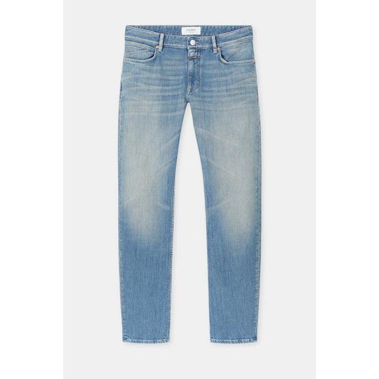 Men's Unity Slim Jean in mid blue from Closed Men's, showing the classic fit and denim texture with subtle fading.