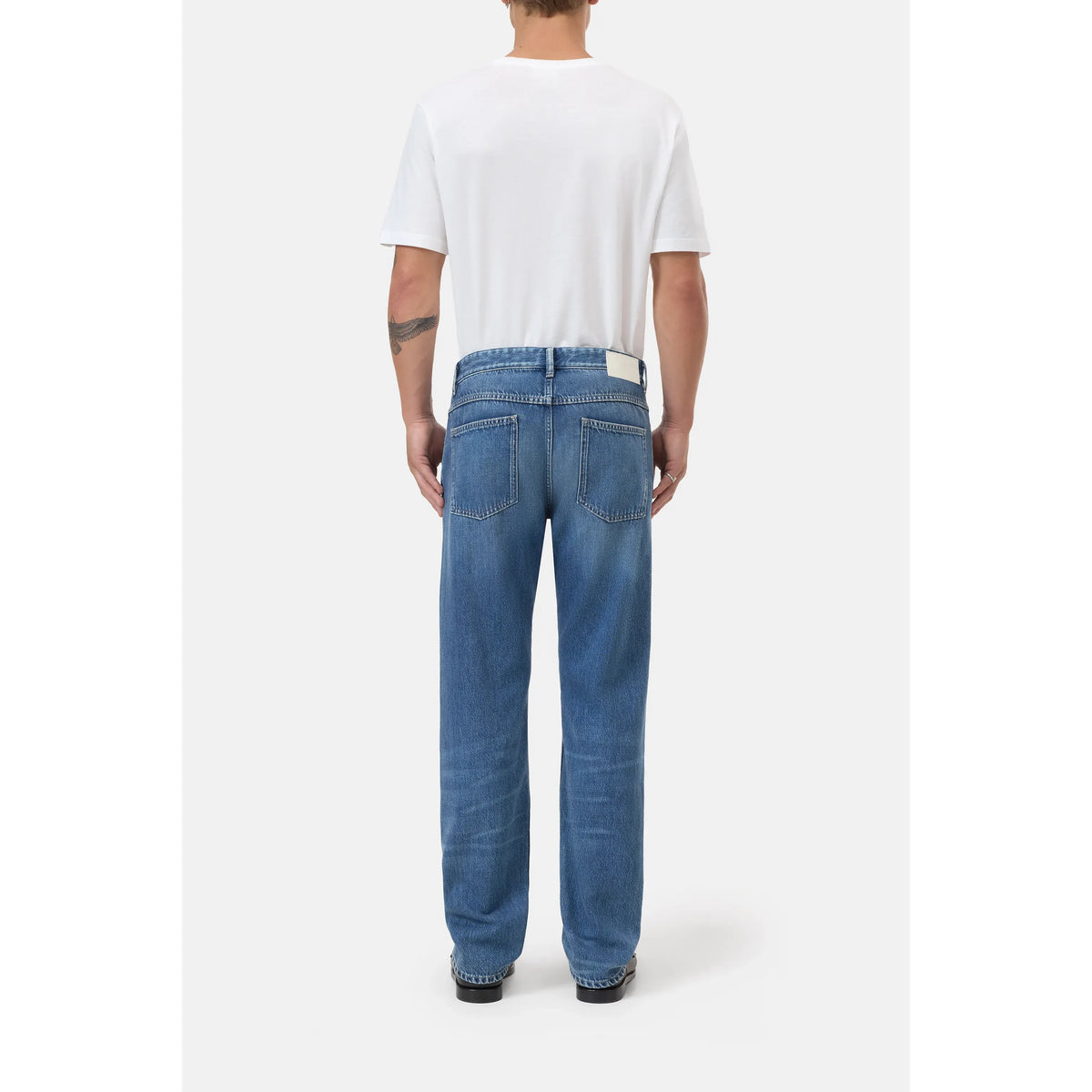 Men's Cooper True Regular Jean in mid blue, closed brand denim, showing front view with classic fit and detailed stitching.