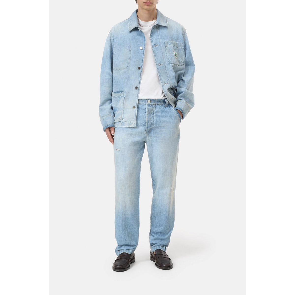 Light blue men's Toledo tapered relaxed jeans by Closed Men's, showing the fit and denim fabric details.