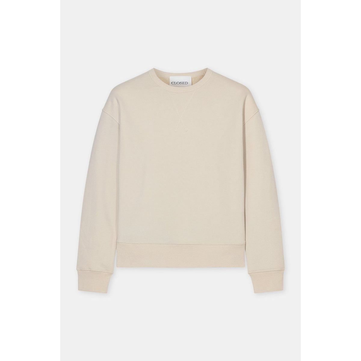Men's Closed Crewneck Sweatshirt in almond cream, showing the soft fabric and classic fit on a hanger.