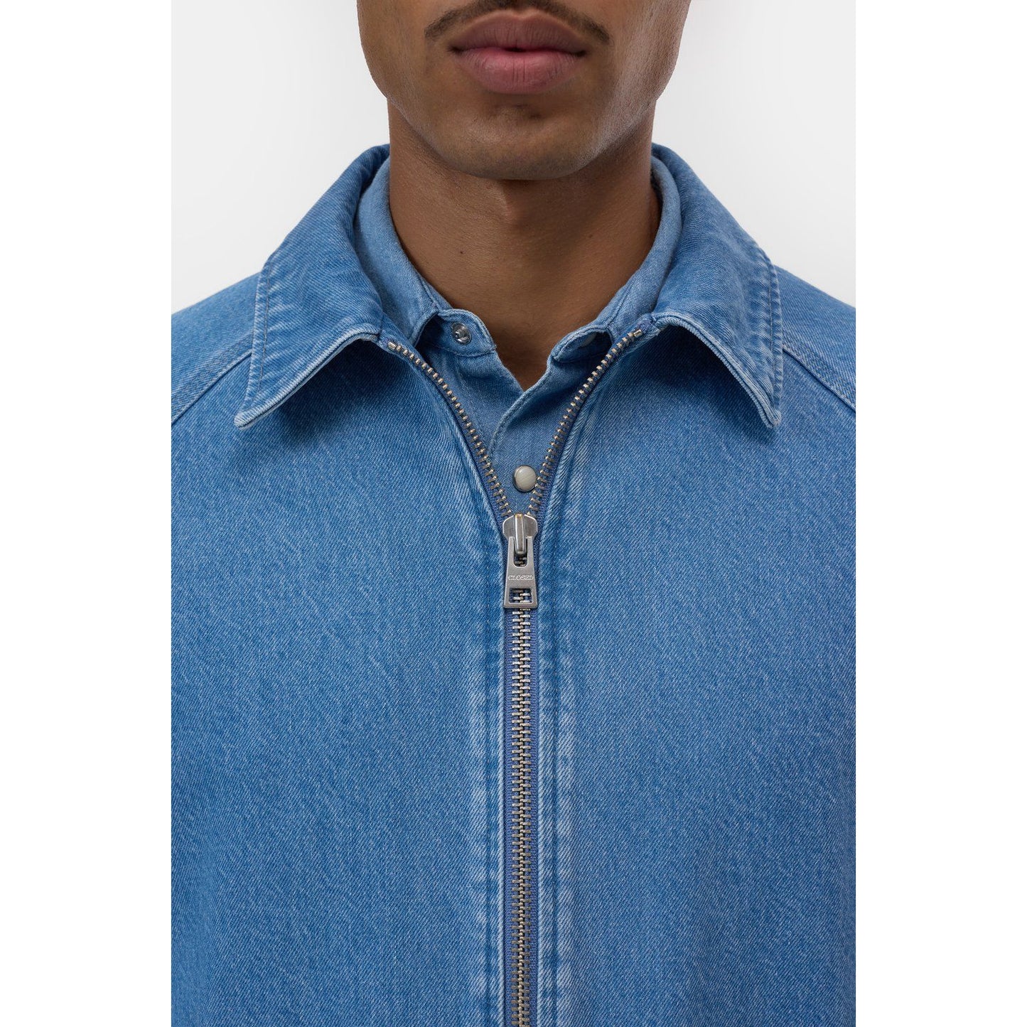 Men's Postal Denim Jacket in mid blue by Closed Men's, featuring classic denim fabric and a casual, stylish fit.