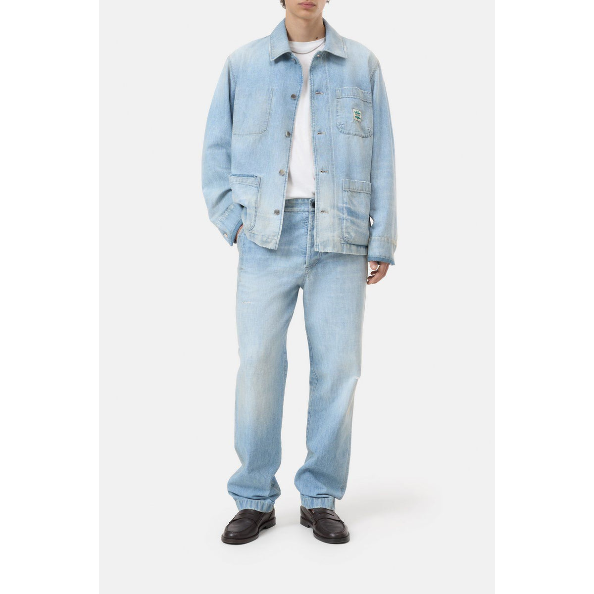 Light blue men's Worker Denim Jacket by Closed Men's, shown on a hanger with visible stitching and button details.
