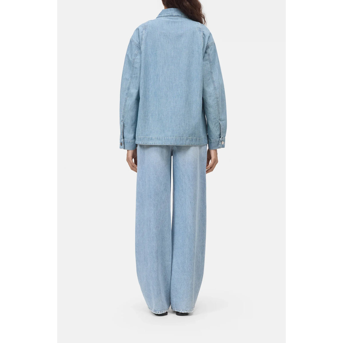 Light blue women's worker jacket by Closed Women's, shown on a model with front pockets and a zip closure.