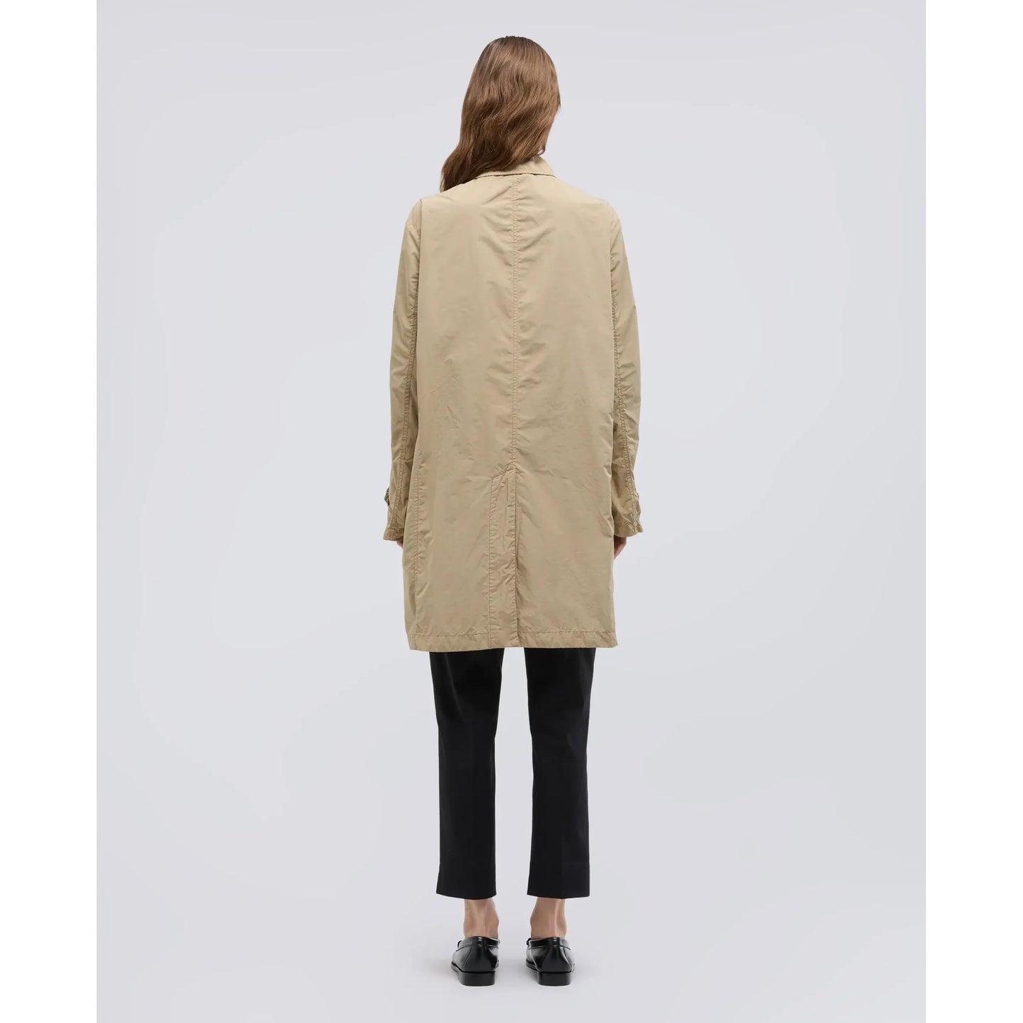 Women's white Aspesi raincoat made from polyester and compact nylon, shown hanging with a sleek, modern design