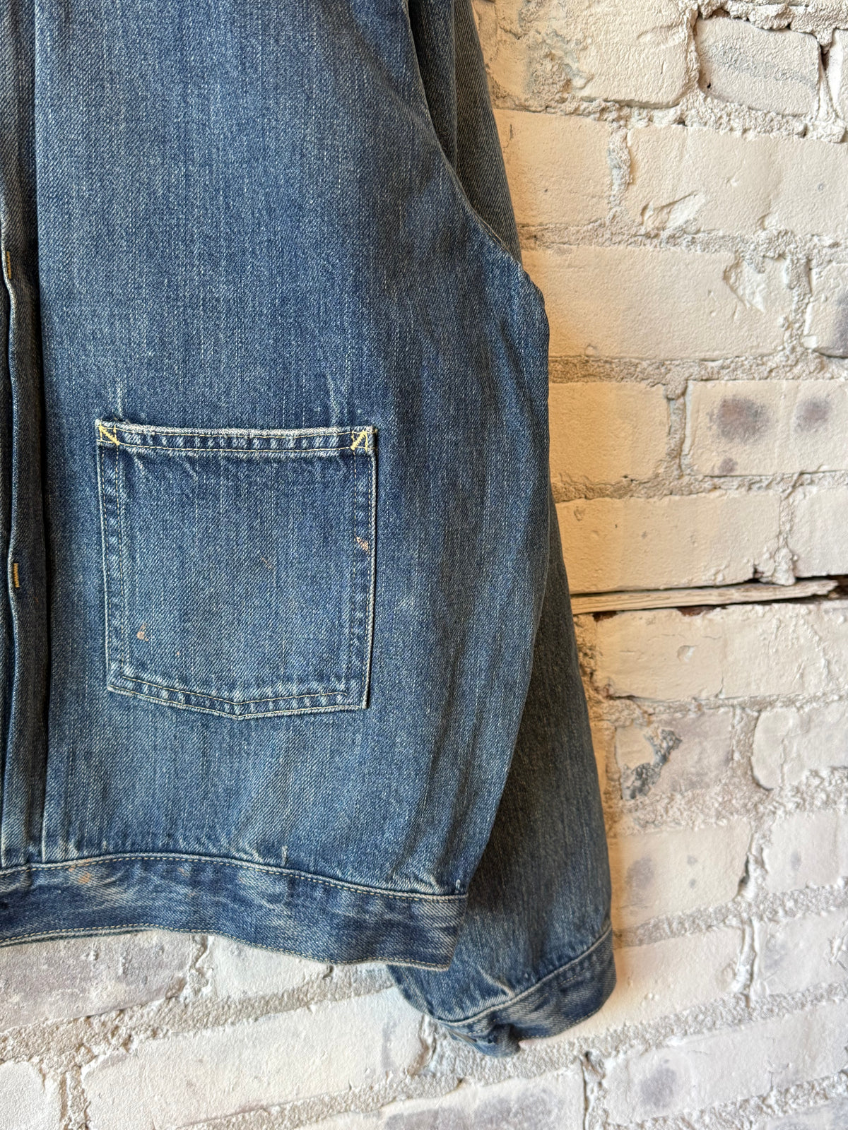 Unisex 12oz vintage light selvedge denim short jacket by Chimala, shown on a mannequin with rolled sleeves and classic fit.