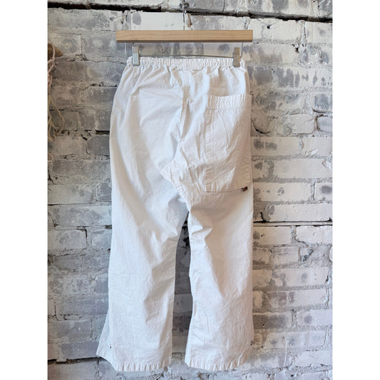 Women's white Homestud OutofSight Poplinair Flapsnap kite pant by Freecity, featuring a relaxed fit and stylish design.
