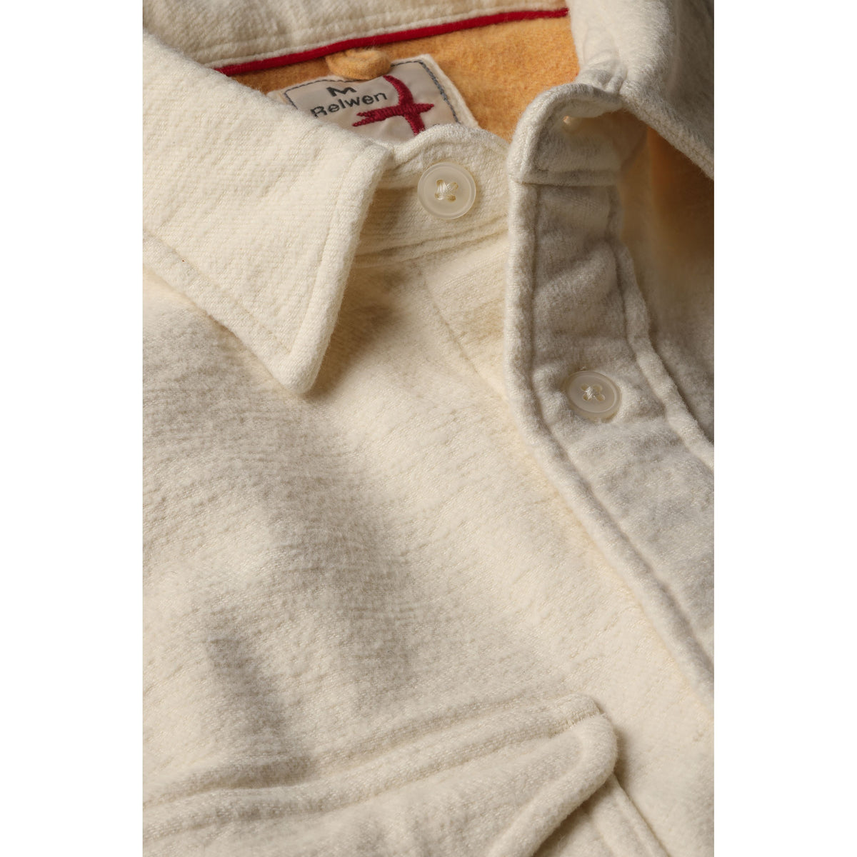 Men's utility workshirt by Relwen in bone felted twill fabric, featuring a durable design with a button-up front and chest pockets.