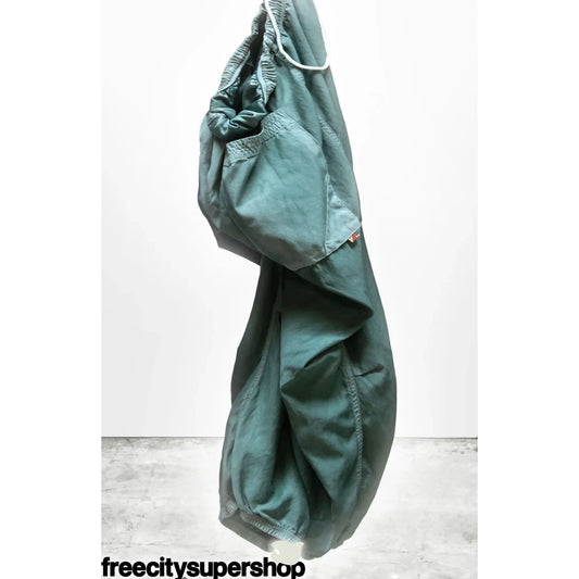 Women's matte and satin loose drawcord Biggy pants by Freecity in Eatgreen color, featuring a relaxed fit and adjustable waistband.