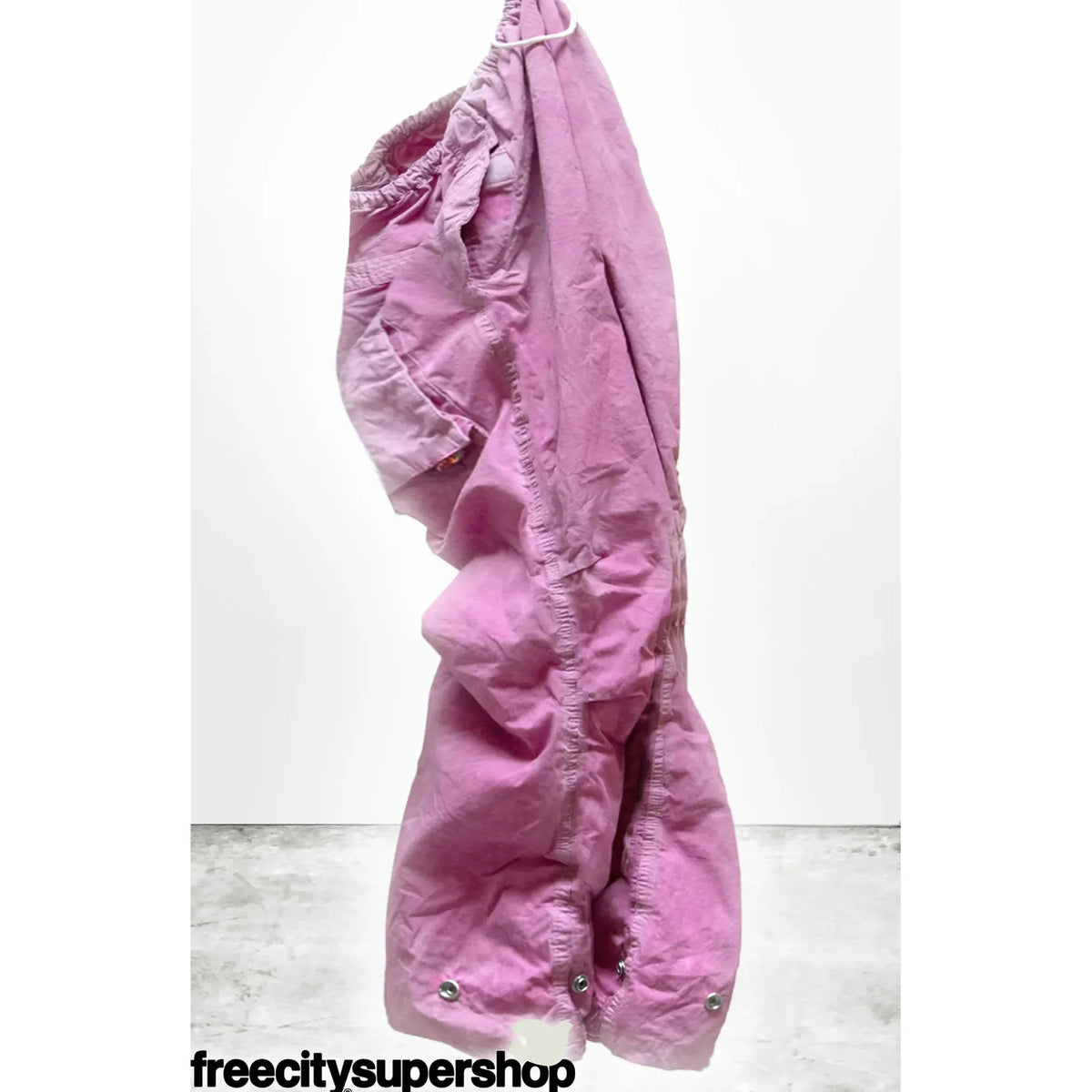 Women's pink Plant Kite Pant by Freecity featuring poplin fabric, air flap, and snap closure, styled with a relaxed fit.