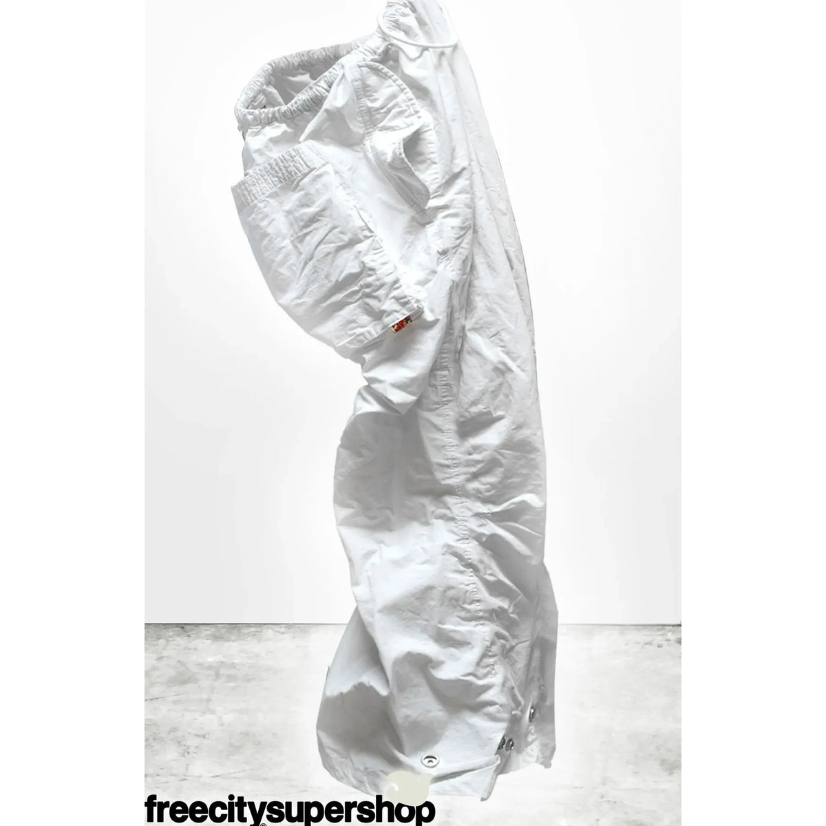 Women's Freecity Outofsight Poplin Air Flap Snap Kite Pant in white, showcasing the relaxed fit and stylish plant print fabric.