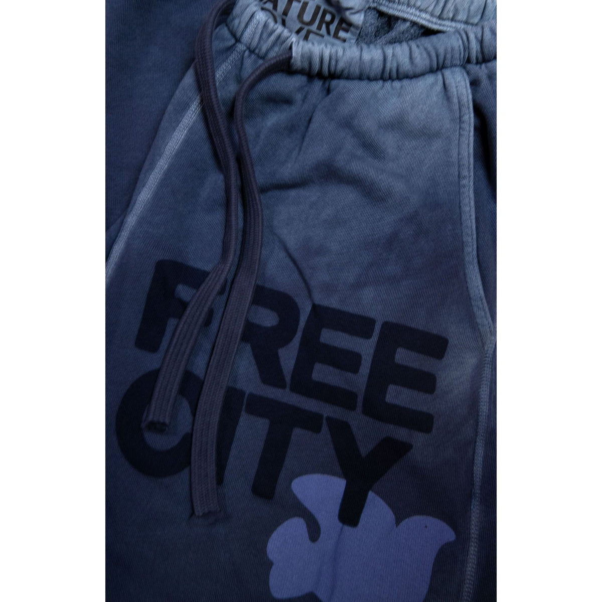 Women's Freecity large Sunfades pocket sweatpant with moonshrooms print, featuring a relaxed fit and comfortable elastic waistband.