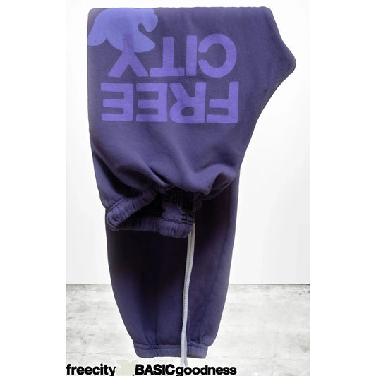 Women's Freecity large sweatpants with purple bush pattern, cozy fit, soft fabric, and relaxed style.