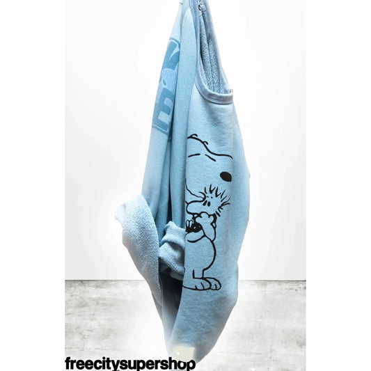 Women's Freecity BasicGoodness Schulz SuperVintag Yumm Snoopy blue raglan sweatshirt with Snoopy graphic design.