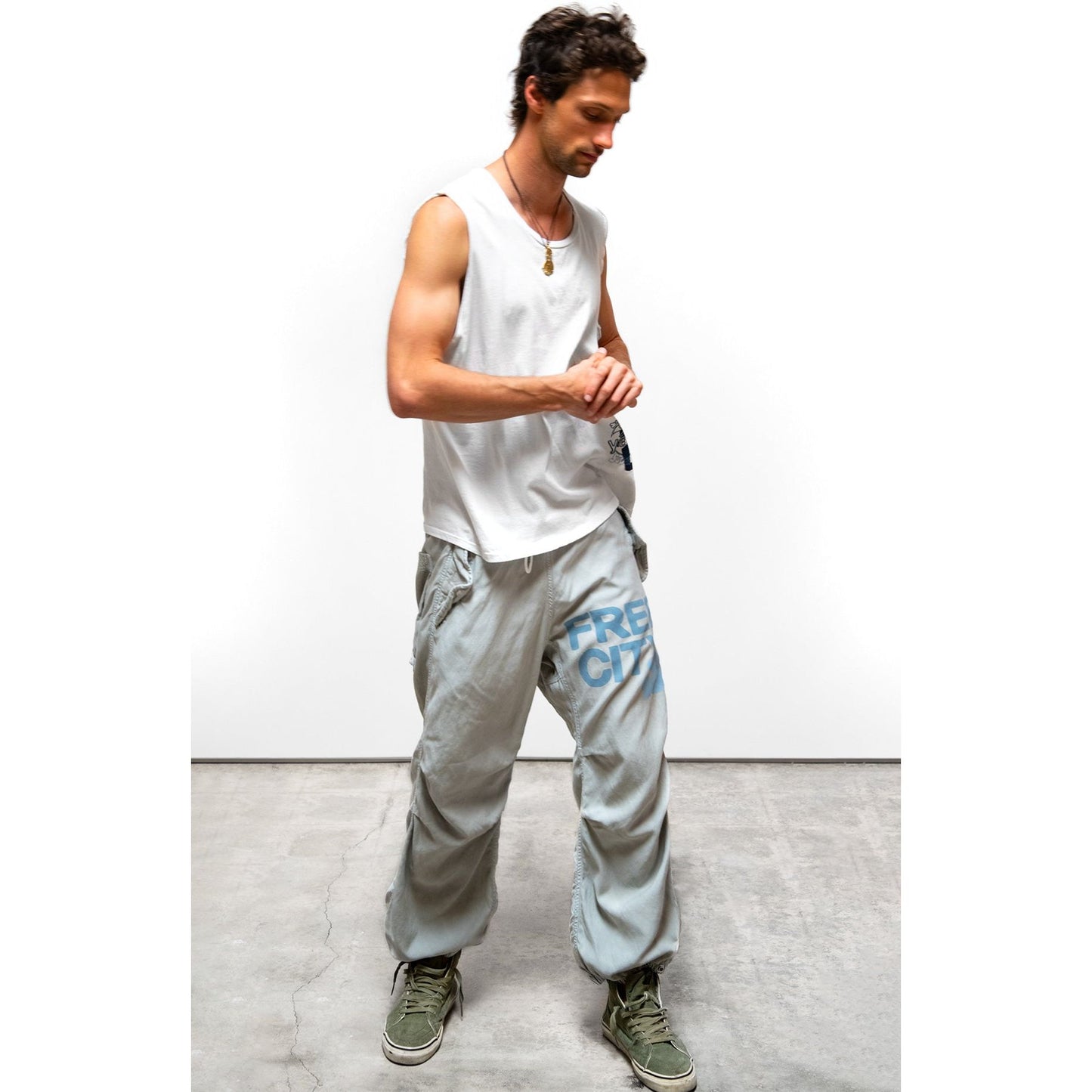 Women's silver rock blues Freecity large matte satin Airjump pant with flap and snap details, shown in a stylish, relaxed fit.