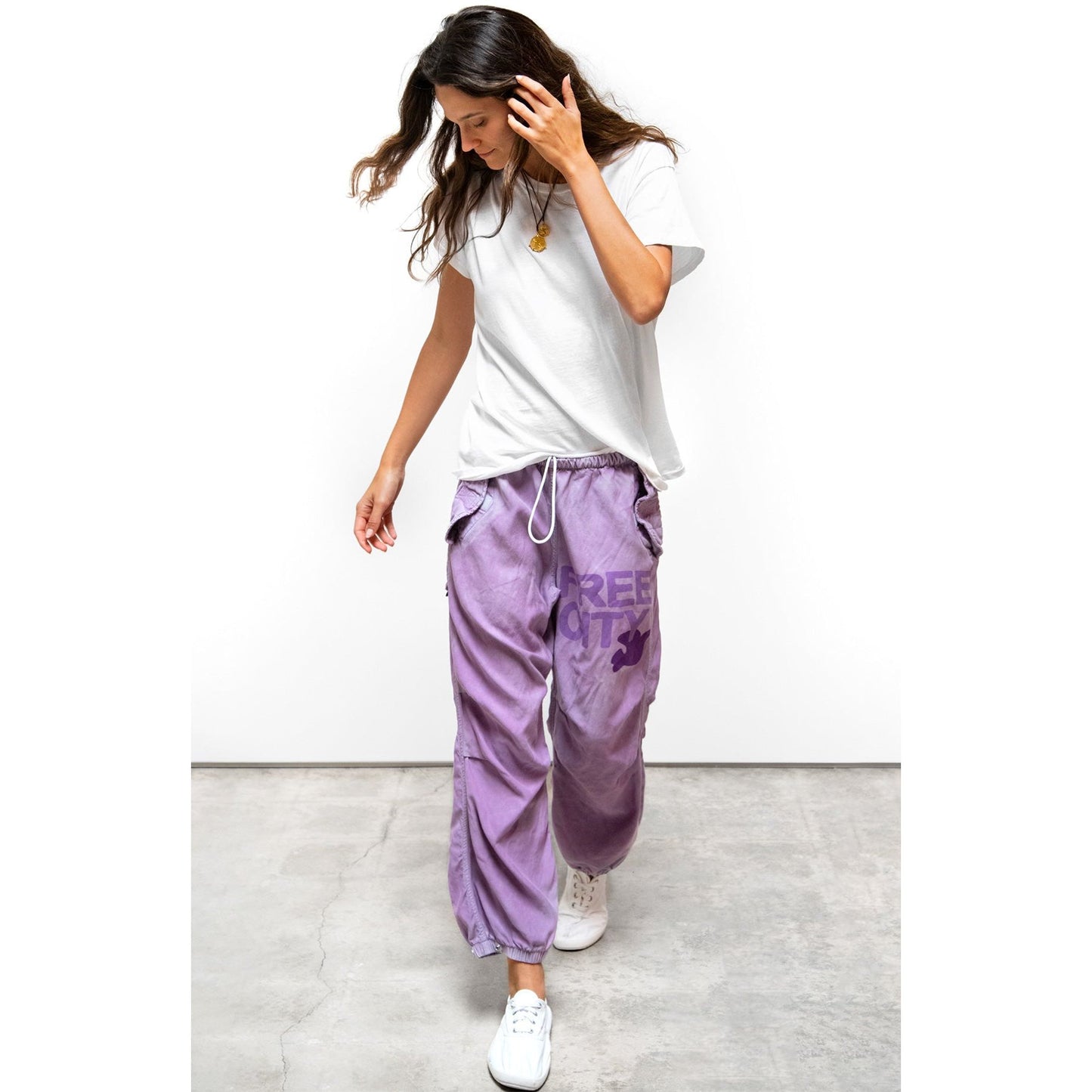 Women's Freecity Airjump Pant in matte satin with flap and snap details, featuring a relaxed fit and moonshroom pattern.