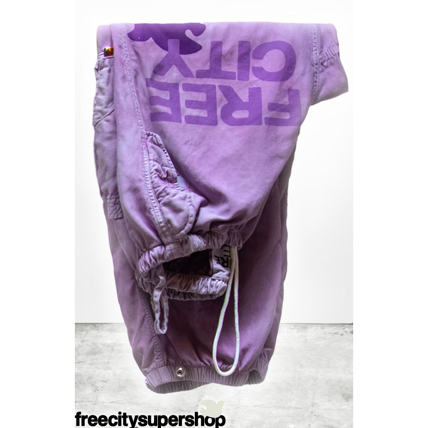 Women's Freecity Airjump Pant in matte satin fabric, featuring flap and snap details, in a large, stylish bloom color.