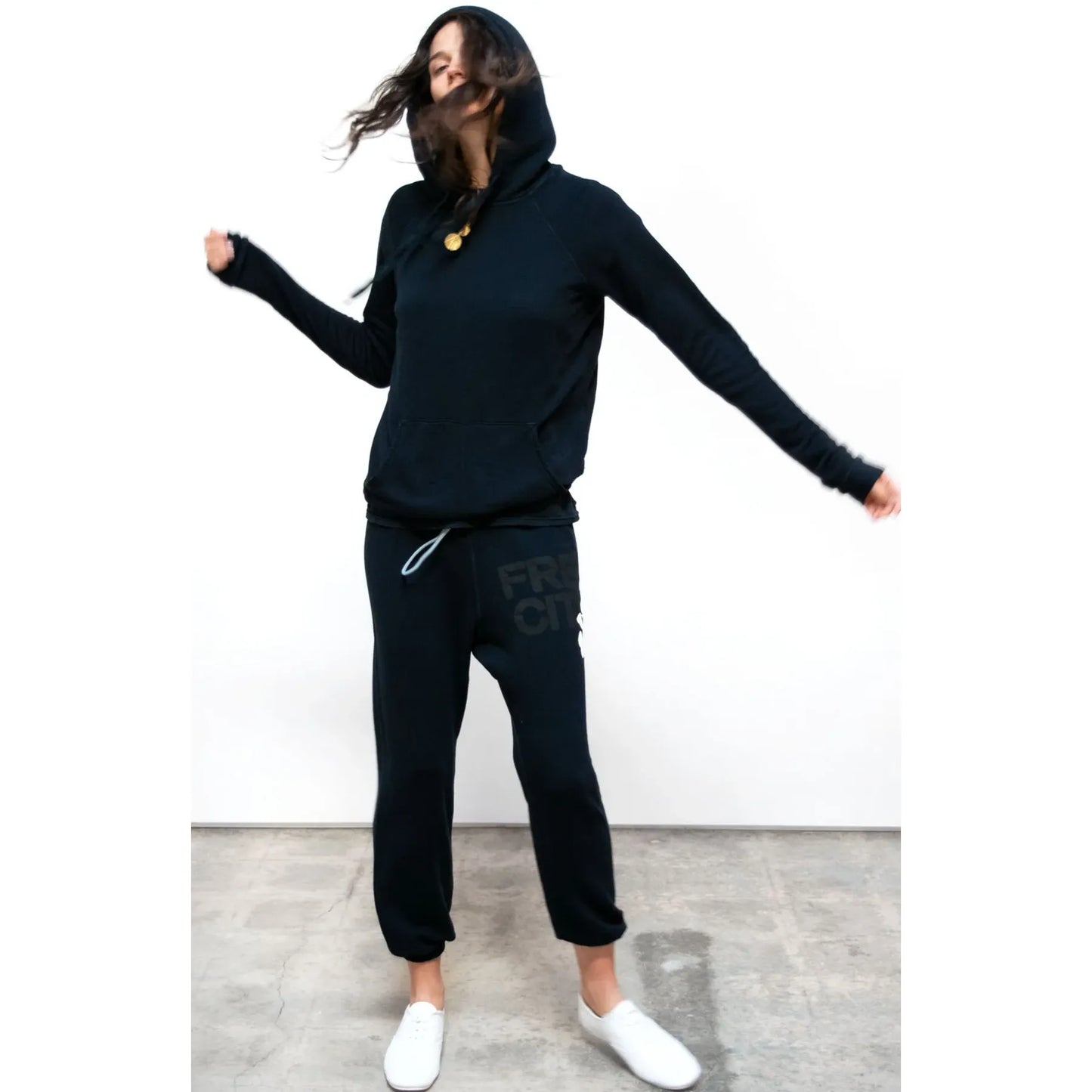 Women's Freecity Superfluff Lux OG sweatpants in Deepspace Cream, showcasing the soft, cozy fabric and relaxed fit.