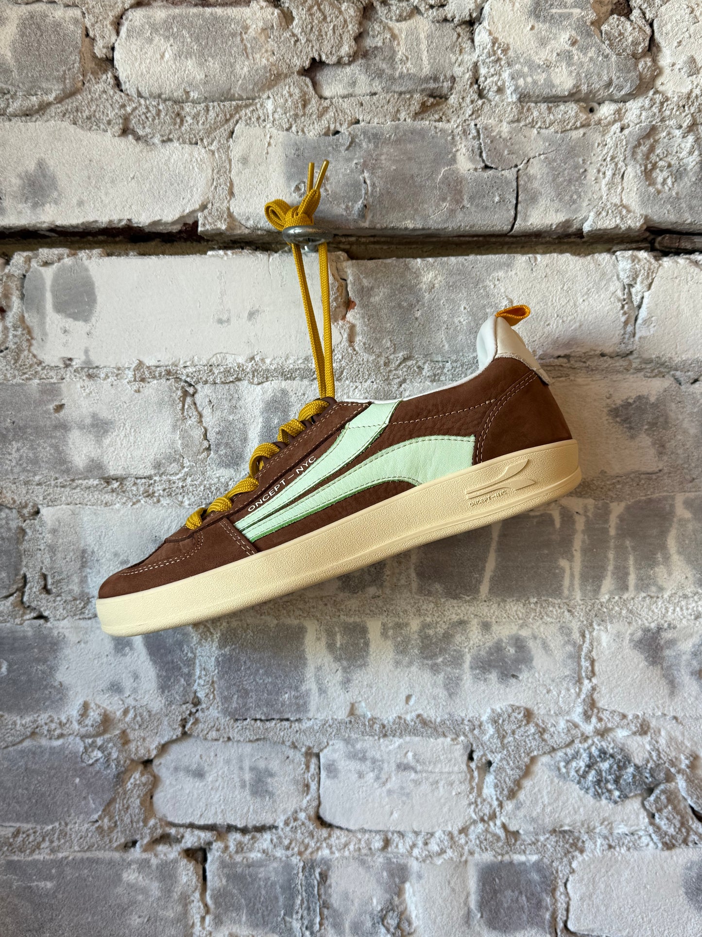 Fez Women's Mocha sneaker by Oncept showing stylish casual sneaker with mocha-colored upper and white sole.