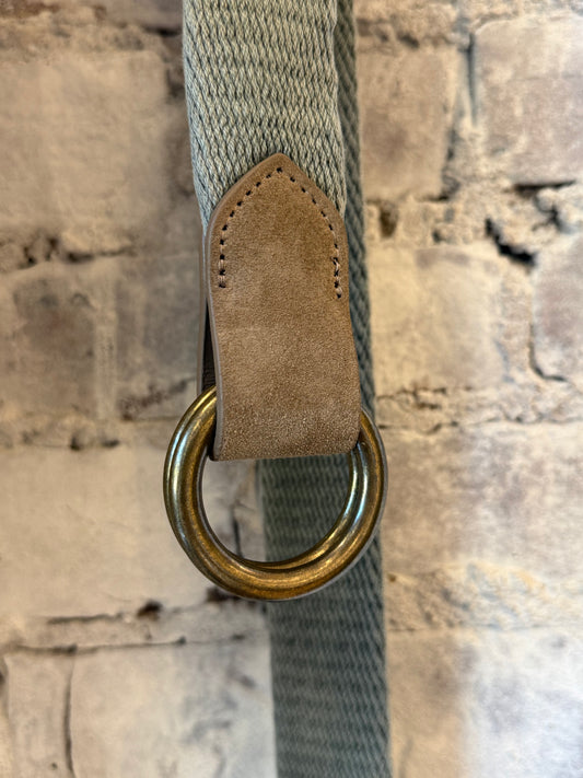 Grey cotton weave O-ring belt with Bison tabs by W. Kleinberg, showing the textured fabric and metal O-ring closure.