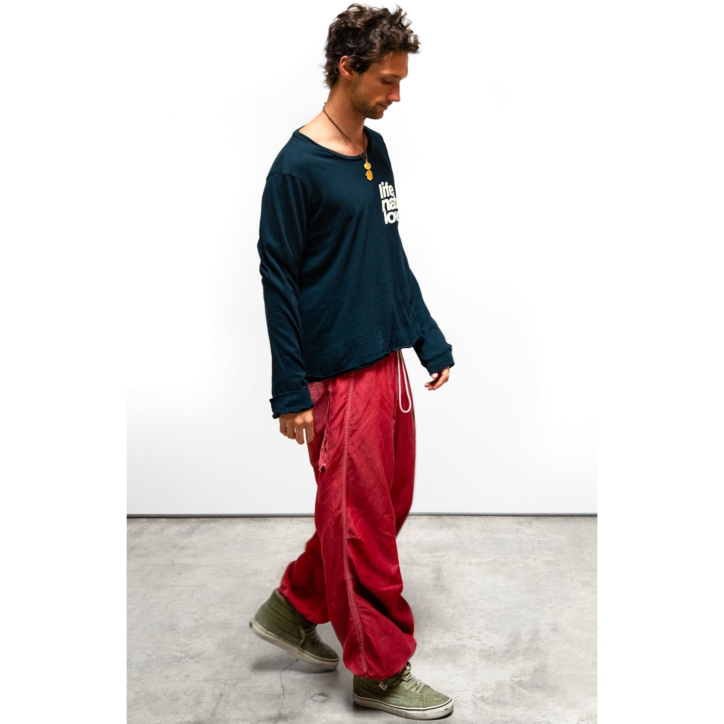 Women’s matte satin loose drawcord Biggy pants by Freecity in vibrant Artyard Red, featuring a relaxed fit and adjustable waistband.