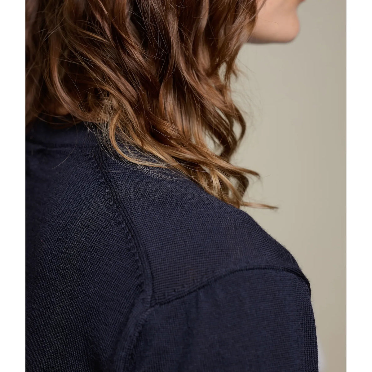 Dark navy Merz B. Schwanen women's short sleeve merino wool T-shirt, close-up showing soft fabric and fitted style.
