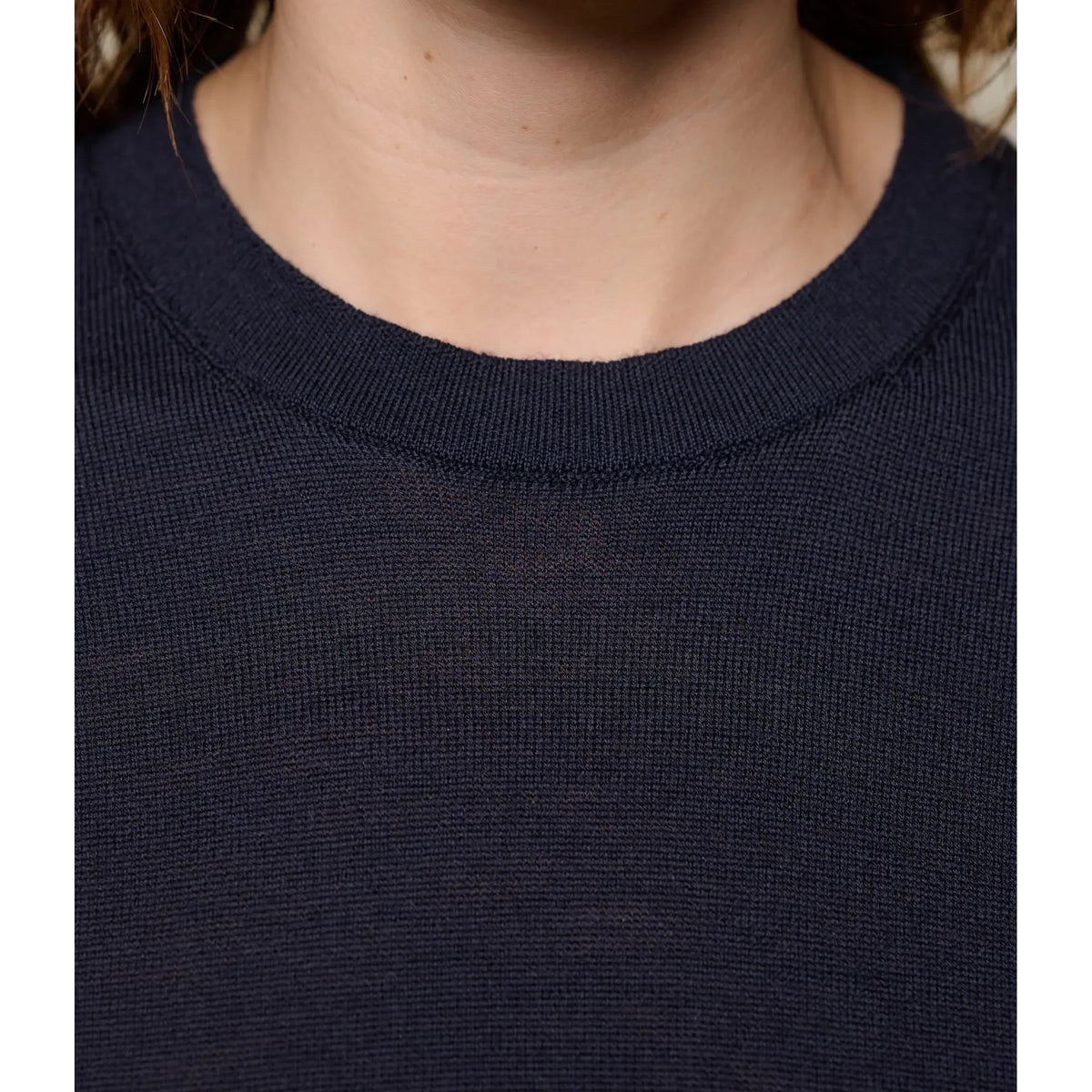 Dark navy women's short sleeve Merino wool T-shirt by Merz B. Schwanen, close-up showing soft fabric and fit details.
