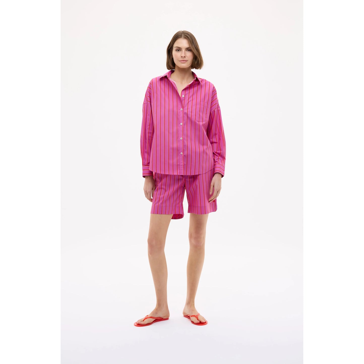 Women's Chiara long sleeve shirt by LMND in fuchsia, true red, and natural colors, displayed on a mannequin.