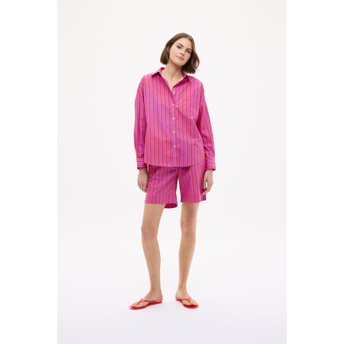 Women's Chiara Mid Length Short by LMND in Fuchsia, True Red, and Natural Stripe with a stylish, colorful striped pattern.