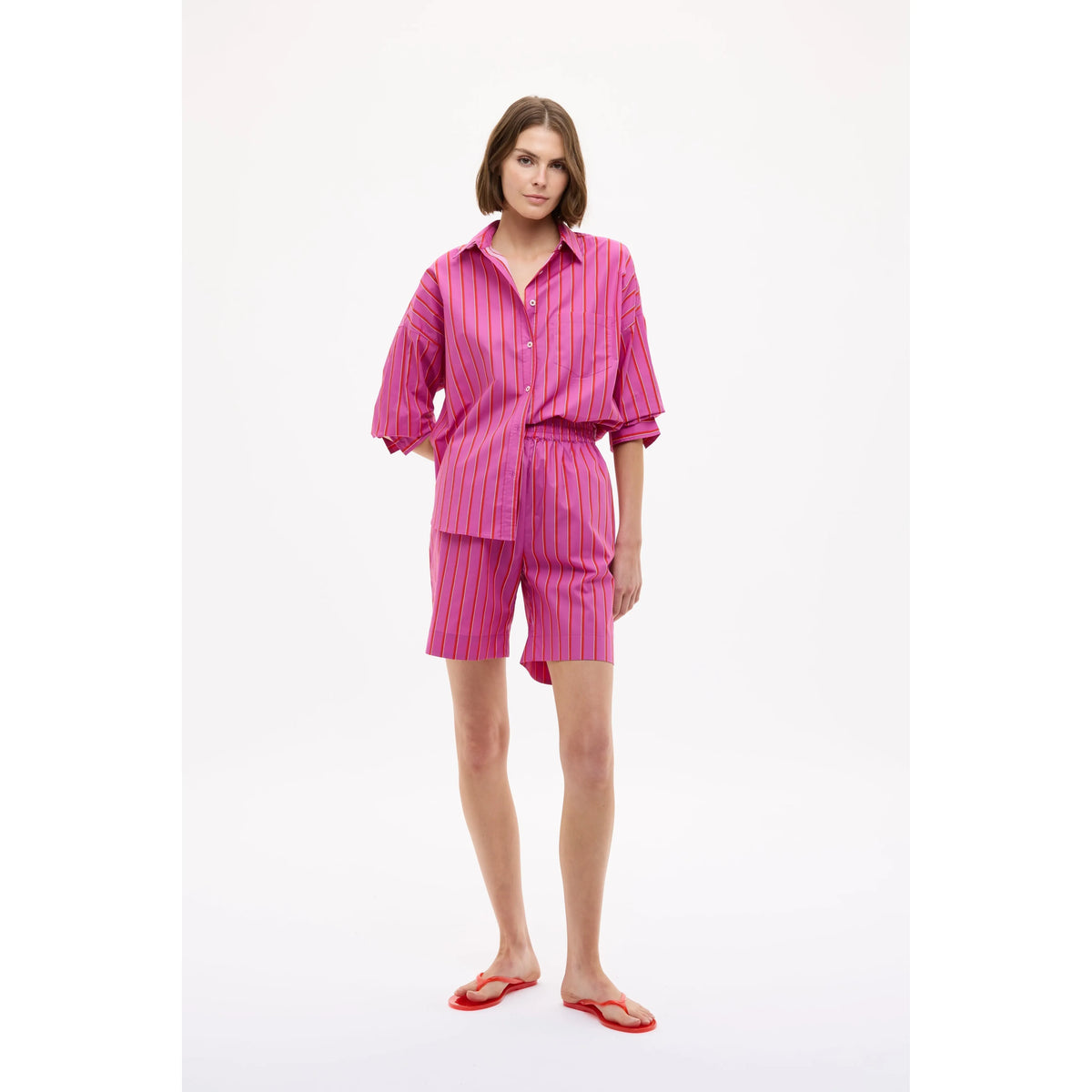 Women's Chiara long sleeve shirt by LMND in fuchsia, true red, and natural, shown in a stylish fit with button details.