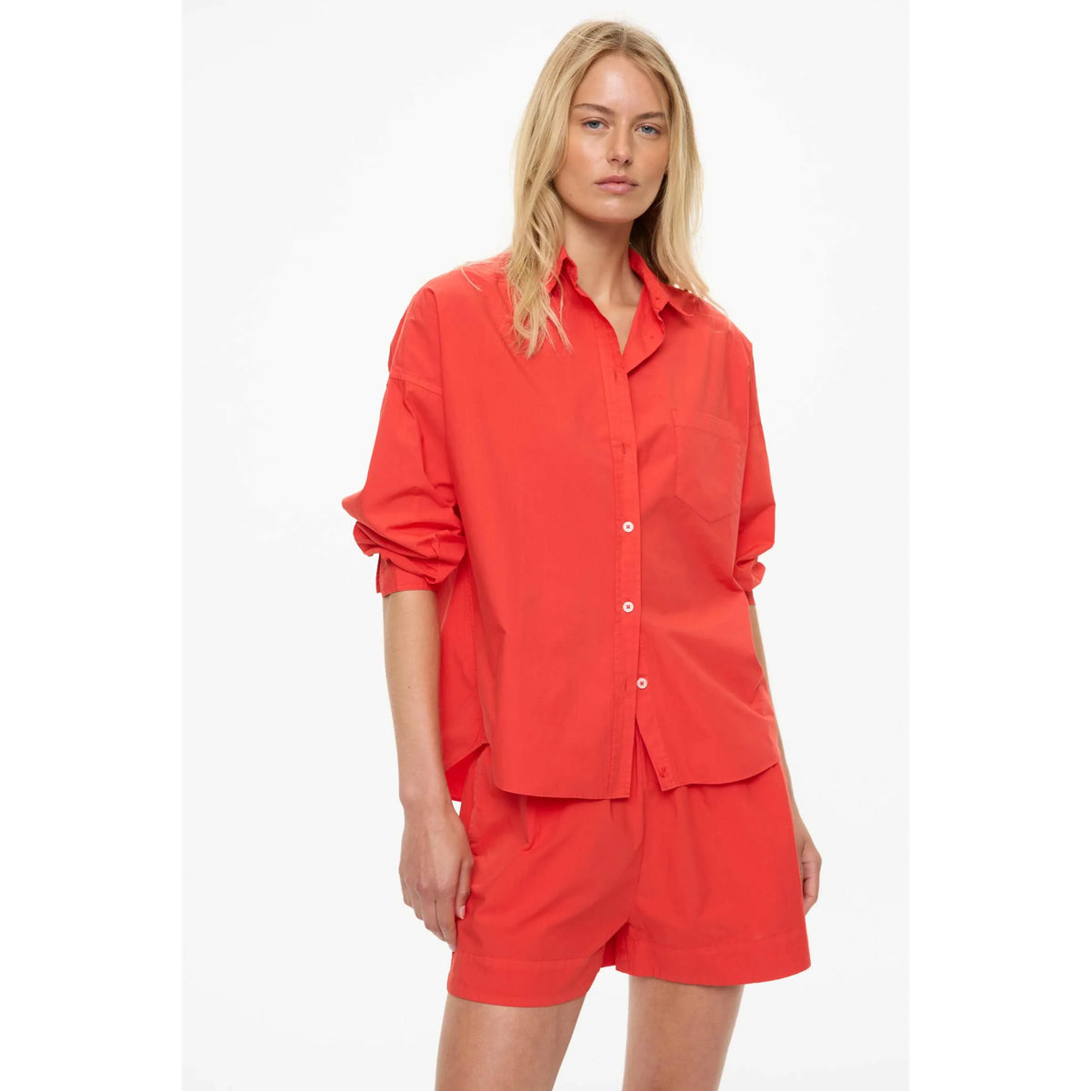 Women's Chiara Shorts in true red by LMND, featuring a stylish fit and vibrant color, displayed on a neutral background.